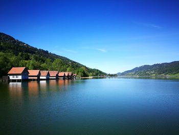 Scenic view of lake against blue sky