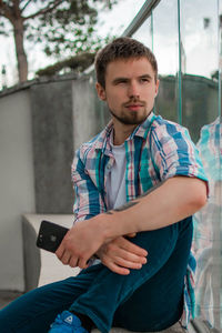 Young man using mobile phone