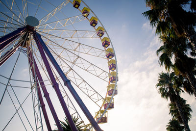 Low angle view of ferris wheel against sky