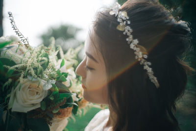 Close-up of bride with bouquet