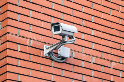 Low angle view of camera on wall