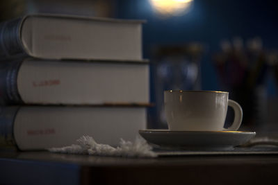 View of a teacup on the desk with books