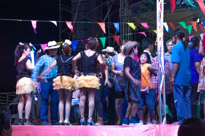 Group of people at market stall