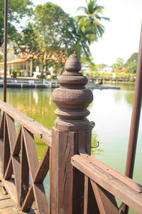 Close-up of wood against lake