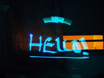 Illuminated neon sign at night