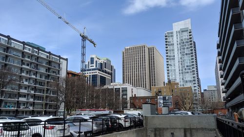 Modern buildings in city against sky