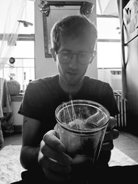 Portrait of man holding ice cream