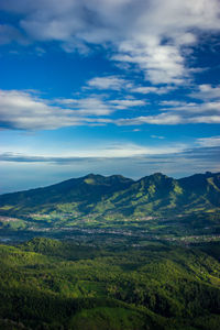 Scenic view of landscape against blue sky