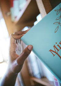 Cropped hand of man using digital tablet