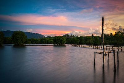 Scenic view of lake against sky during sunset