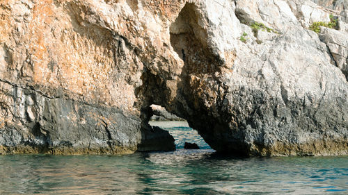 Scenic view of rock formation in sea