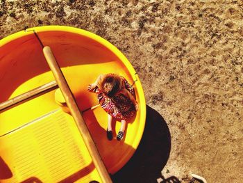 High angle view of girl on slide at playground