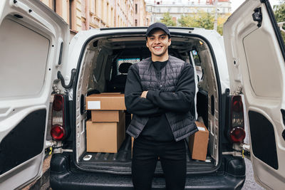 Portrait of a smiling young man in car