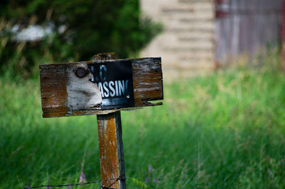 Close-up of information sign on field