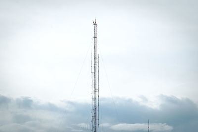 Low angle view of electricity pylon against sky