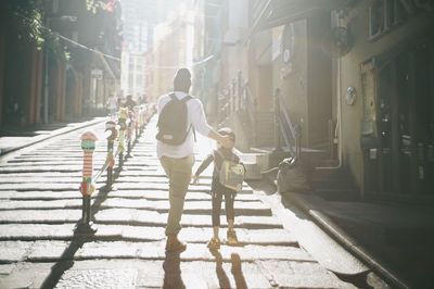 People walking on street in city