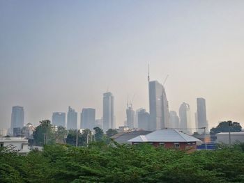 Modern buildings in city against sky