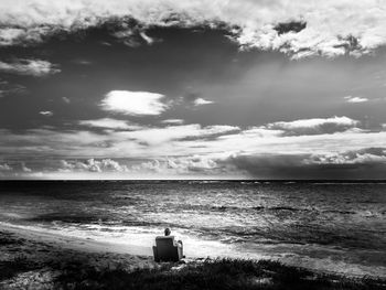 Scenic view of sea against cloudy sky