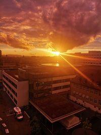 High angle view of buildings against sky during sunset