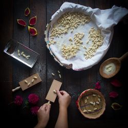 High angle view of woman preparing food on table