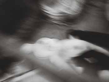 Blurred motion of woman holding hands