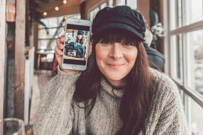 Portrait of young woman using mobile phone