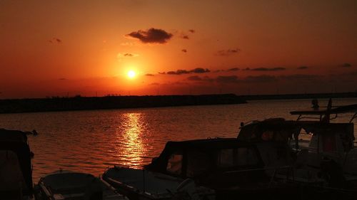 Scenic view of sea against orange sky during sunset