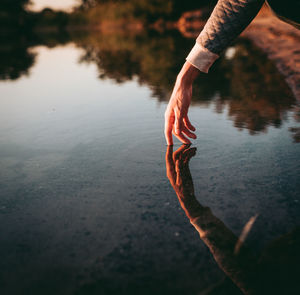 Reflection of person in lake