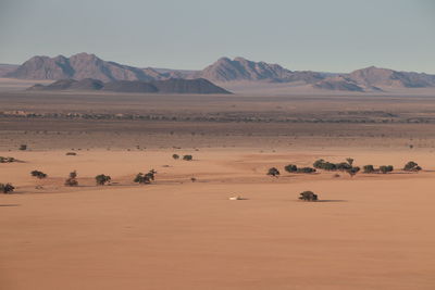 Scenic view of desert against clear sky