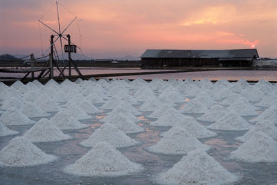 Scenic view of beach against sky during sunset
