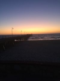 Scenic view of sea against clear sky during sunset