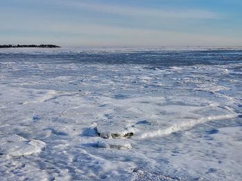 Scenic view of sea against sky during winter