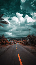 Road amidst plants against sky