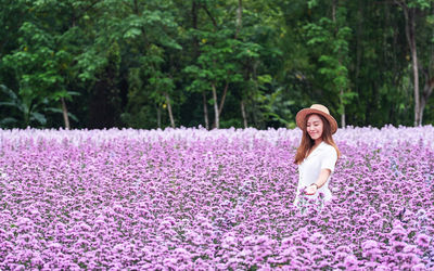 Portrait image of a beautiful young asian woman in margaret flower field
