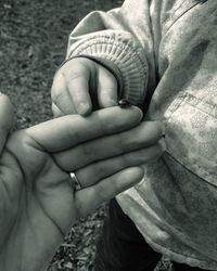 Cropped image of woman and son with ladybug