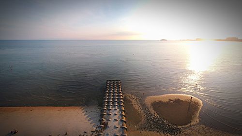 Scenic view of sea against sky at sunset