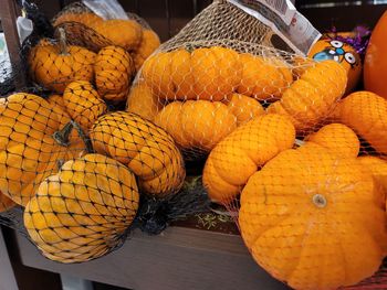 Close-up of orange fruits in market for sale