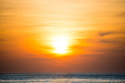 Scenic view of sea against romantic sky at sunset