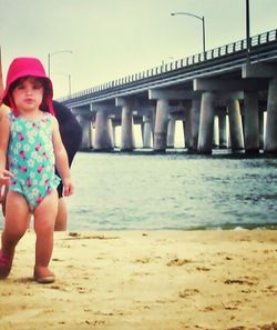 Full length of girl enjoying at beach