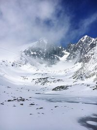 Scenic view of frozen lake against sky