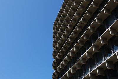 Low angle view of building against clear blue sky