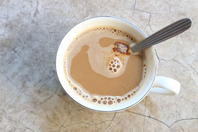 High angle view of coffee cup on table