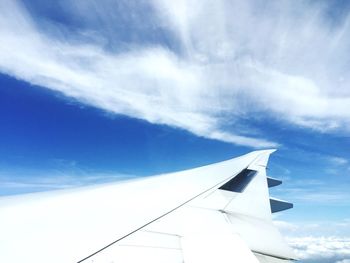 Low angle view of airplane flying in sky