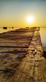 Scenic view of sea against clear sky during sunset