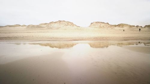 Scenic view of desert against sky