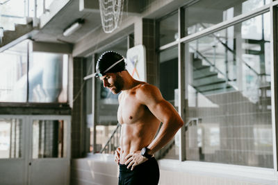 Full length of shirtless man standing