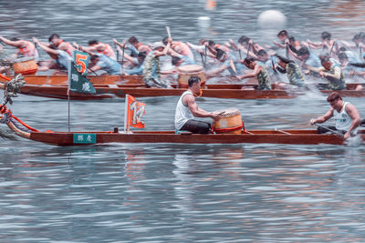 Group of people on boat in lake