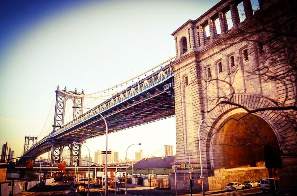 bridge - man made structure, architecture, built structure, city, transportation, city life, travel destinations, building exterior, outdoors, sky, day, sunset, low angle view, cityscape, road, no people