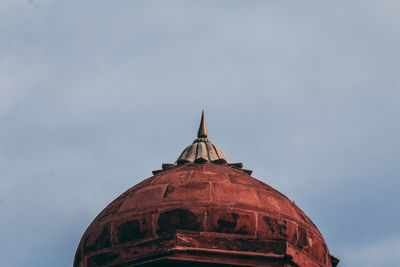 Low angle view of bell tower against sky