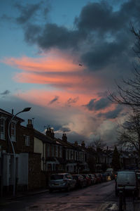View of cityscape against dramatic sky